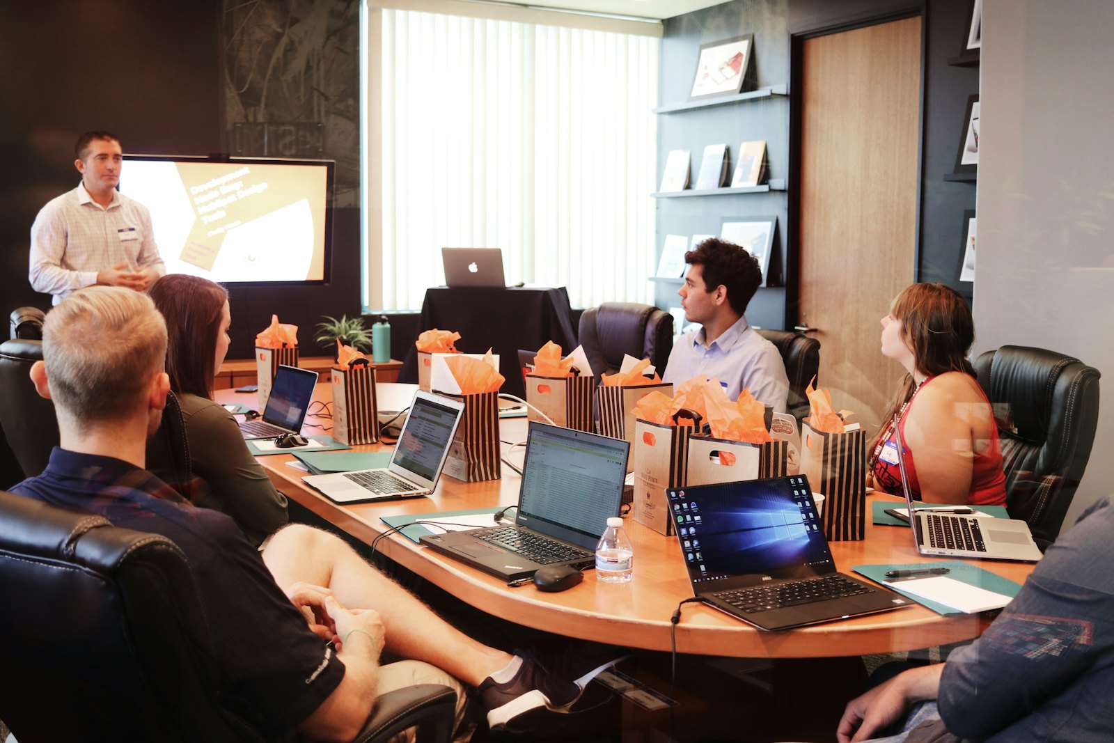 A team in a conference room walking through a session together